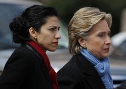 US Democratic presidential candidate Senator Hillary Clinton (D-NY) (R) walks with her traveling chief-of-staff Huma Abedin as they approach a group of police officers after cancelling a rally in Fort Worth, Texas February 22, 2008. A Dallas police officer was killed Friday when his motorcycle struck a pillar as he was escorting democratic presidential candidate Senator Clinton to a rally in Dallas. Clinton cancelled the rally in Forth Worth, saying it would be inappropriate to hold a rally in light of the tragic circumstances. REUTERS/Jessica Rinaldi (UNITED STATES) US PRESIDENTIAL ELECTION CAMPAIGN 2008 (USA)